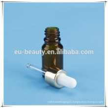 Skin care essential oil bottle with shiny silver dropper lid